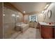Bathroom boasts a large soaking tub, walk-in shower, and double vanity at 5861 E Valley Hi Dr, Parker, CO 80138