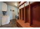 Laundry room features washer, dryer, built-in storage, and slate tile flooring at 5861 E Valley Hi Dr, Parker, CO 80138