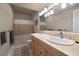 Shared bathroom with double sinks and shower at 5861 E Valley Hi Dr, Parker, CO 80138