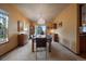 Bright dining room with a large table, chandelier, and stained glass window at 5861 E Valley Hi Dr, Parker, CO 80138