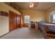 Upstairs bedroom with wood floors, built-in shelves, and a loft at 5861 E Valley Hi Dr, Parker, CO 80138