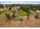 Aerial view of house, large backyard, and surrounding landscape at 5861 E Valley Hi Dr, Parker, CO 80138