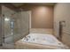 Bathroom with a large walk-in shower and a soaking tub at 5861 E Valley Hi Dr, Parker, CO 80138