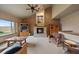 Vaulted ceilings and large windows offer stunning views from this living room at 5861 E Valley Hi Dr, Parker, CO 80138