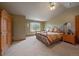 Main bedroom with vaulted ceilings, large window, and en-suite bathroom at 5861 E Valley Hi Dr, Parker, CO 80138