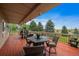 Deck with patio furniture, offering scenic views at 5861 E Valley Hi Dr, Parker, CO 80138