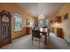 Bright dining room with a large table, chandelier, and stained glass window at 5861 E Valley Hi Dr, Parker, CO 80138