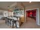 Home bar in the basement, with a granite countertop at 5861 E Valley Hi Dr, Parker, CO 80138