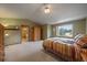 Spacious main bedroom with a vaulted ceiling, large window, and en-suite bathroom at 5861 E Valley Hi Dr, Parker, CO 80138