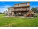 Two-story house with expansive deck and patio at 5861 E Valley Hi Dr, Parker, CO 80138