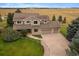 Two-story house with a large yard and driveway at 5861 E Valley Hi Dr, Parker, CO 80138