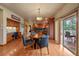 Eat-in kitchen with a table for four and access to deck at 5861 E Valley Hi Dr, Parker, CO 80138
