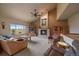Vaulted ceilings and large windows offer stunning views from this living room at 5861 E Valley Hi Dr, Parker, CO 80138
