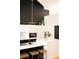Modern kitchen with white cabinets, a large island, and stylish pendant lights at 2556 18Th St, Denver, CO 80211