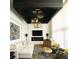 Spacious living room featuring a unique chandelier and comfortable seating at 2556 18Th St, Denver, CO 80211