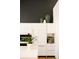 Modern white kitchen with stainless steel appliances and sleek cabinetry at 2556 18Th St, Denver, CO 80211