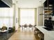 Open concept dining area with hardwood floors and modern lighting at 2556 18Th St, Denver, CO 80211