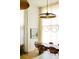 Elegant dining room with a long wooden table and unique lighting fixtures at 2556 18Th St, Denver, CO 80211