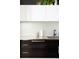 Modern kitchen with dark wood cabinets and stainless steel countertops at 2556 18Th St, Denver, CO 80211