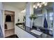 Modern bathroom with double vanity and walk-in shower at 1230 Sugarloaf Ln, Erie, CO 80516
