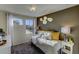 Bright bedroom with a cozy bed and charming decor at 1230 Sugarloaf Ln, Erie, CO 80516