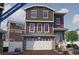 Two-story home with a two-car garage and landscaping at 1230 Sugarloaf Ln, Erie, CO 80516
