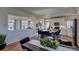 Modern kitchen with white cabinets, large island, and stainless steel appliances at 1230 Sugarloaf Ln, Erie, CO 80516