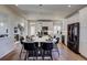 Modern kitchen with white cabinets, large island, and stainless steel appliances at 1230 Sugarloaf Ln, Erie, CO 80516