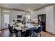 Modern kitchen with white cabinets, large island, and stainless steel appliances at 1230 Sugarloaf Ln, Erie, CO 80516
