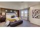 Spacious main bedroom with large windows and cozy bedding at 1230 Sugarloaf Ln, Erie, CO 80516