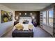 Main bedroom with accent wall and comfortable seating at 1230 Sugarloaf Ln, Erie, CO 80516
