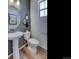 Stylish powder room with pedestal sink and toilet at 1230 Sugarloaf Ln, Erie, CO 80516