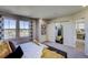 Second bedroom with barn door leading to bathroom at 1230 Sugarloaf Ln, Erie, CO 80516