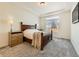 Spacious bedroom with a large window and carpeted flooring at 16487 E 111Th Pl, Commerce City, CO 80022
