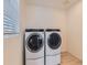 Bright laundry room features a side-by-side washer and dryer at 16487 E 111Th Pl, Commerce City, CO 80022