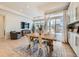 Bright dining area with wooden table and access to backyard at 16487 E 111Th Pl, Commerce City, CO 80022