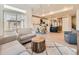 Bright and airy living area featuring an open floor plan with a view into the kitchen at 16487 E 111Th Pl, Commerce City, CO 80022