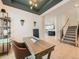 Bright home office with a view of the staircase and kitchen at 16487 E 111Th Pl, Commerce City, CO 80022