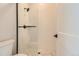 Modern bathroom with a walk-in shower and patterned tile at 6664 Bridle Creek Pt, Castle Pines, CO 80108