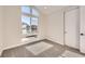 Bright bedroom with large window and grey carpet at 6664 Bridle Creek Pt, Castle Pines, CO 80108