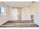 Bedroom with sliding barn doors leading to en-suite bathroom at 6664 Bridle Creek Pt, Castle Pines, CO 80108