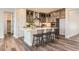 Modern kitchen with gray cabinets, quartz countertops, and an island at 6664 Bridle Creek Pt, Castle Pines, CO 80108