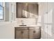 Laundry room with gray cabinets and a white countertop at 6666 Bridle Creek Pt, Castle Pines, CO 80108