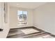 Bright home office with large windows and hardwood floors at 6664 Bridle Creek Pt, Castle Pines, CO 80108