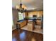 Kitchen with light wood cabinets, granite island, and stainless steel appliances at 2855 Rock Creek Cir # 158, Superior, CO 80027