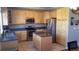 Kitchen with stainless steel appliances and an island at 2855 Rock Creek Cir # 158, Superior, CO 80027