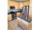 Kitchen features stainless steel appliances and wood cabinets at 2855 Rock Creek Cir # 158, Superior, CO 80027