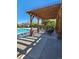 Relaxing poolside patio with pergola and seating at 2855 Rock Creek Cir # 158, Superior, CO 80027