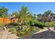 Landscaped backyard with pond, stone patio, and lush greenery at 1843 Spruce St, Boulder, CO 80302