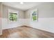 Spacious spare bedroom with wood flooring and wainscoting at 1843 Spruce St, Boulder, CO 80302